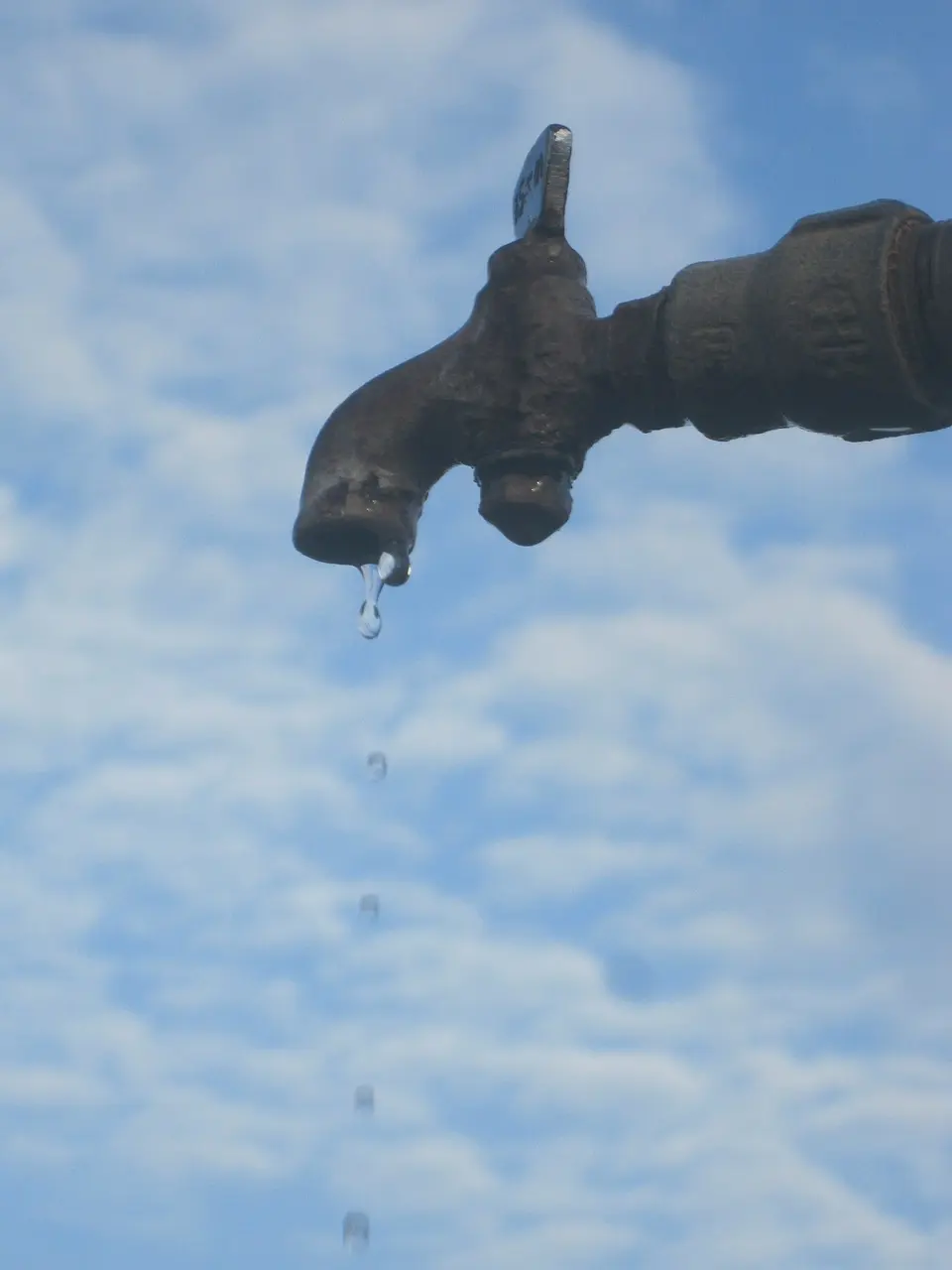 Plumbing leak — dripping water from a fixture