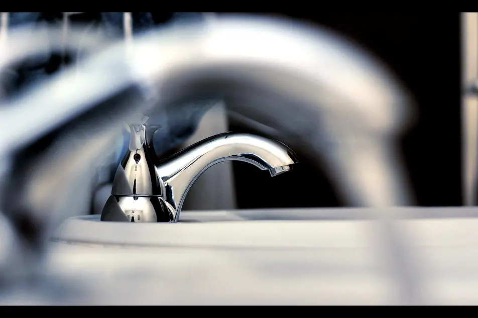 Chrome faucet with running water