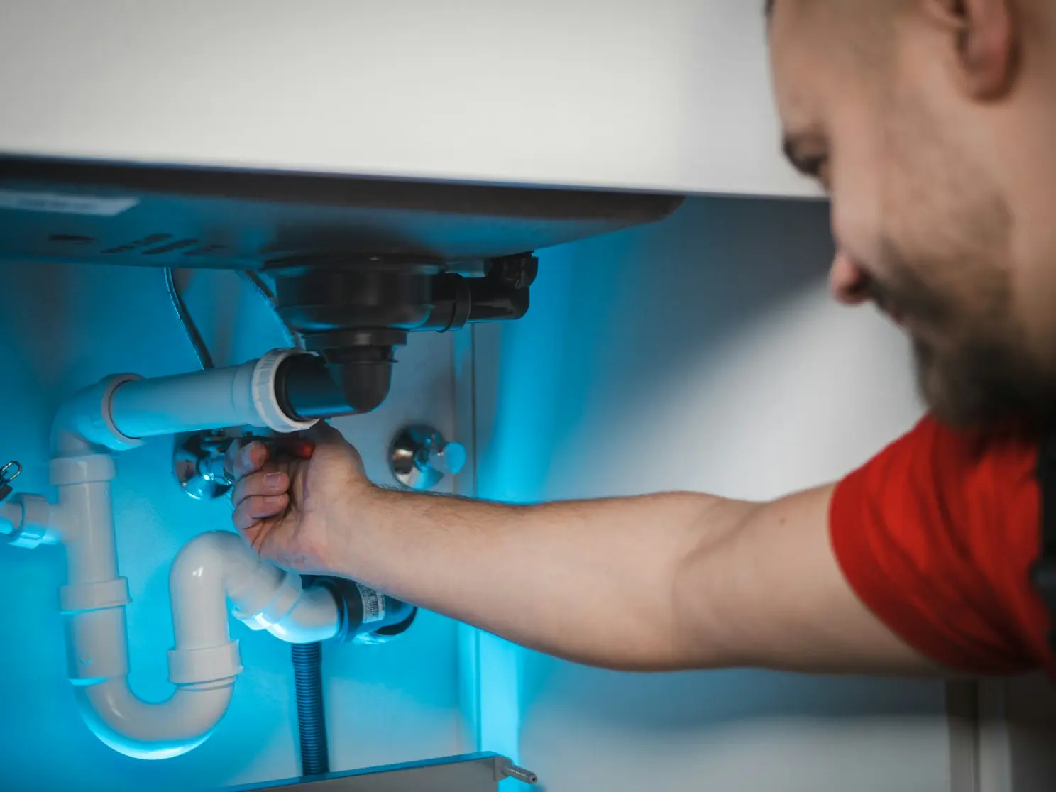 Plumber assembling and fitting water pipes